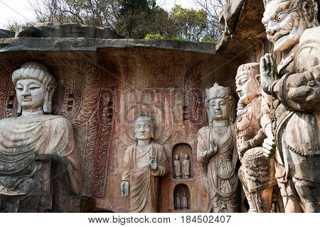 Yuantouzhu - Taihu scenery garden, Wuxi, China APRIL 2017 : Big stone Buddha on the stone wall
