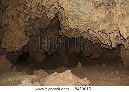 Black copy space next to a rock formation inside the cave at Colossal Cave Mountain Park in Vail, Arizona, USA, near Tucson in the Sonoran Desert.