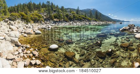 Beautiful boulders and crystal clear water of the lake Tahoe. Hidden Beach, Lake Tahoe - Nevada, USA. Panoramic photo