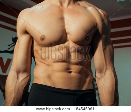 Close up of a man's body in gym