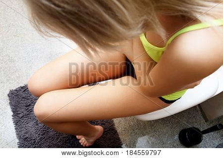 Woman heaving belly ache