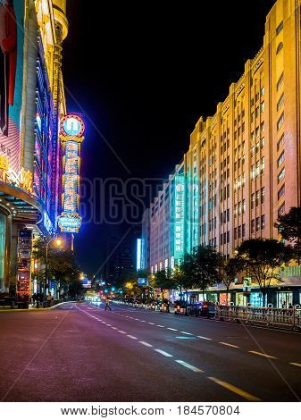 Shanghai, China - Nov 3, 2016: Night scene along Xizang Middle Road - Buildings and neon lights.