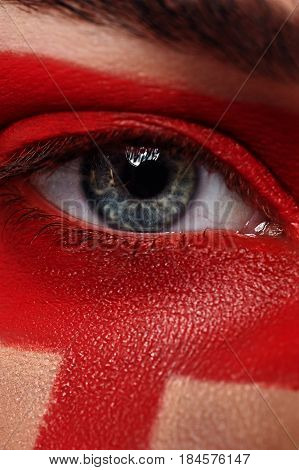 Macro beauty open Eye and red Paint Make-up on Skin