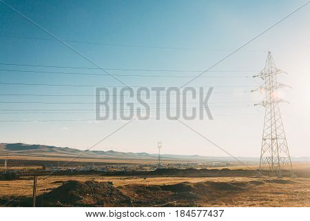 Electric Power Transmission Pylon On Inner Mongolia Grassland Against Blue Sky  ,china