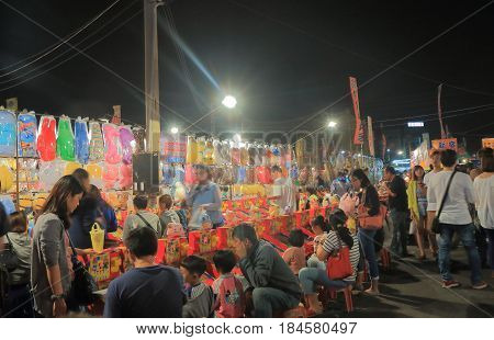 TAINAN TAIWAN - DECEMBER 11, 2016: Unidentified people visit Tainan flower night market. Tainan flower night market is the biggest night market in Tainan.