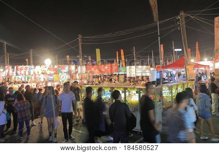 TAINAN TAIWAN - DECEMBER 11, 2016: Unidentified people visit Tainan flower night market. Tainan flower night market is the biggest night market in Tainan.