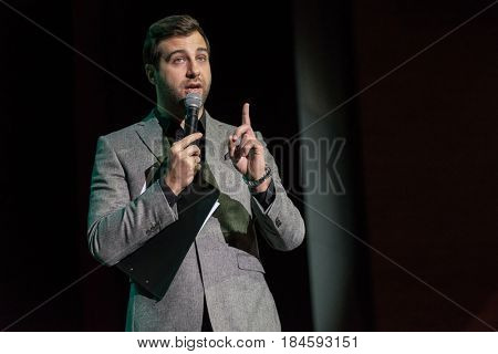 Moscow, Russia - April 24, 2017: Famous Russian showman Ivan Urgant performs at Synergy Global Forum at Crocus Expo Hall. This is one of the largest business forums with more than 5000 participants