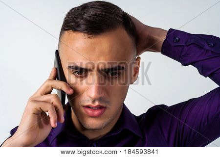 Smiling Young Businessman Using Smart Phone Over White Background.