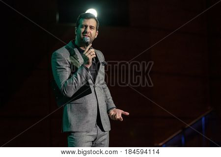 Moscow, Russia - April 24, 2017: Famous Russian showman Ivan Urgant performs at Synergy Global Forum at Crocus Expo Hall. This is one of the largest business forums with more than 5000 participants
