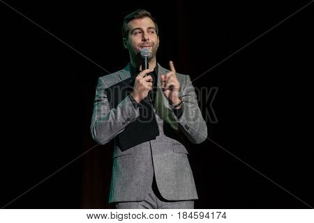 Moscow, Russia - April 24, 2017: Famous Russian showman Ivan Urgant performs at Synergy Global Forum at Crocus Expo Hall. This is one of the largest business forums with more than 5000 participants