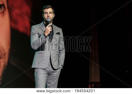 Moscow, Russia - April 24, 2017: Famous Russian showman Ivan Urgant performs at Synergy Global Forum at Crocus Expo Hall. This is one of the largest business forums with more than 5000 participants