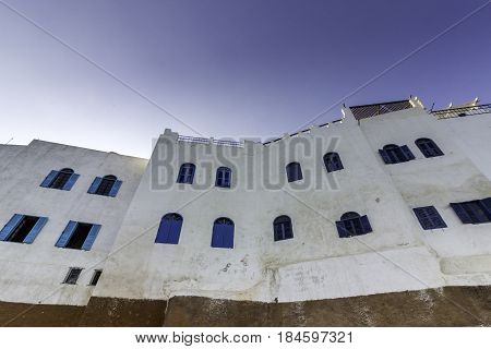 Typical building whit Moroccan windows against a deep blue sky Azemmour El Jadida Morocco