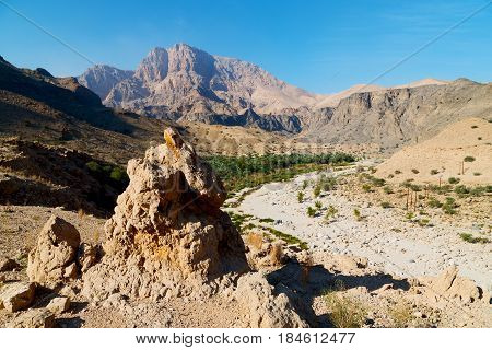 In Oman  The Old Mountain Gorge And Canyon The Deep Cloudy  Sky