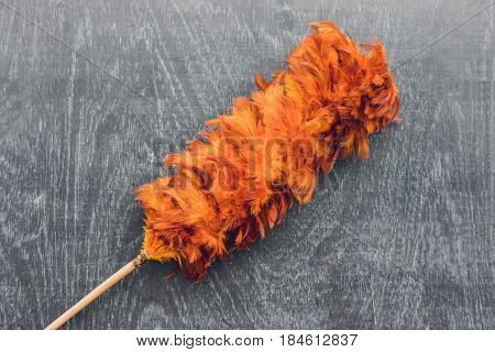 Feather Duster On An Old Wooden Background