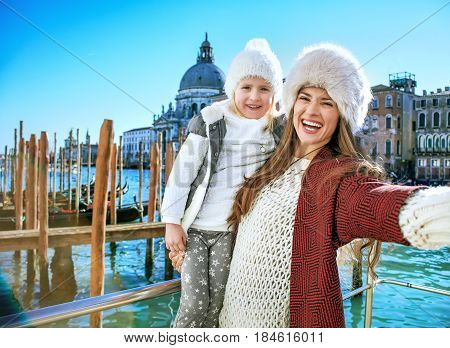 Mother And Daughter Travellers In Venice Taking Selfie