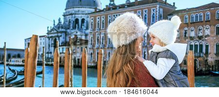 Mother And Daughter Tourists In Venice, Italy Embracing