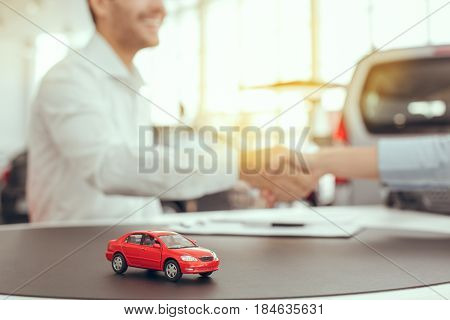 Young man and woman in a car rental service lease contract