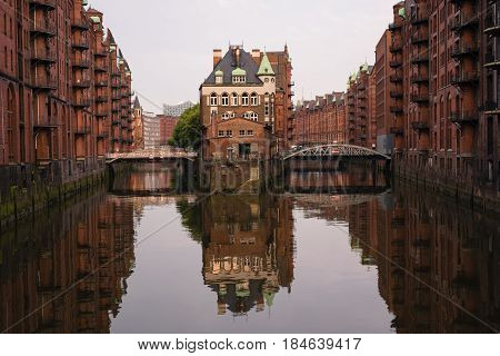 The famous Hamburg Wasserschloss, water castle, with the Wandrahmsfleet bridge in the Speicherstadt in Germany.