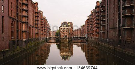The famous Hamburg Wasserschloss, water castle, with the Wandrahmsfleet bridge in the Speicherstadt in Germany.