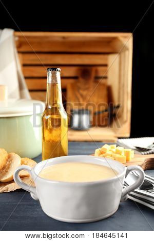 Delicious cream soup in pan on table