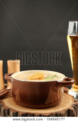 Delicious cream soup with bread on table