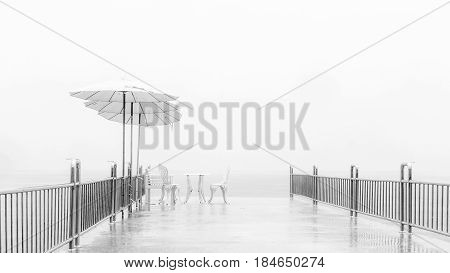 Abstract background Hi key black and white : The relax siting briged in the fog after rain