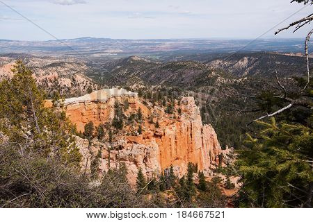From north to south you can see: the Aquarius Plateau (Pink Cliffs) the Kaiparowits Plateau (Grey Cliffs) Molly's Nipple (White Cliffs) and even glimpses of the Kaibab Plateau on which lies the North Rim of the Grand Canyon according to the NPS website