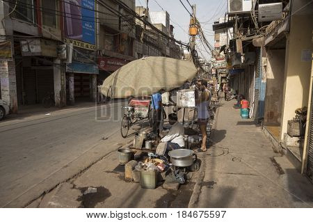 DELHI INDIA - JUN 11 : street tea stall at chawri bazar in old delhi of delhi on june 11 2015 india. milk tea or chai is popular beverage of indian people