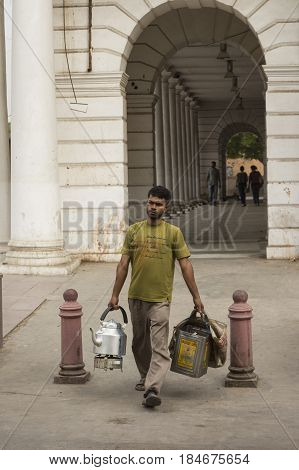DELHI INDIA - JUN 11 : vendor indian tea by walk in Connaught Place of delhi on june 11 2015 india. milk tea or chai is popular beverage of indian people