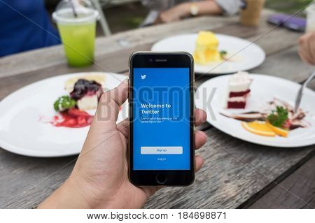 CHIANGMAI THAILAND -April 302017:Iphone 6s open Twitter app.Twitter is an online social networking and microblogging service that enables users to send and read 