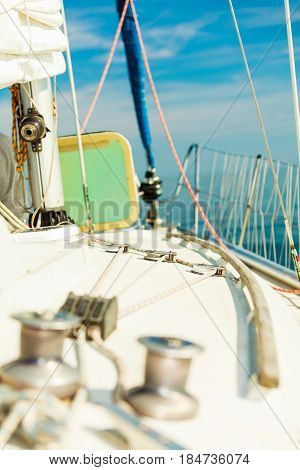 Yacht capstan with rope on sailing boat during cruise marine objects concept.