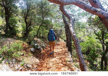 Hiking in famous Lycian Way in the Turkey. Backpacker in the trail.