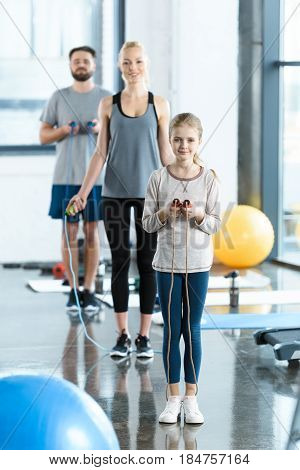 Young Fitness People Exercising With Skipping Ropes At Sports Center