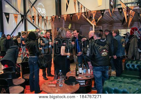 St. Petersburg Russia - 15 April, A crowd of bikers in the bar,15 April, 2017.
International Motor Show IMIS-2017 in Expoforurum.
Visitors and participants of the annual moto-salon in St. Petersburg.
