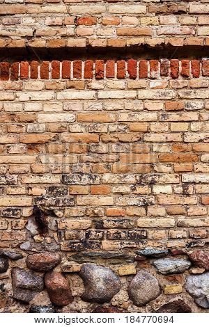 Yellow brick wall background with stone basement