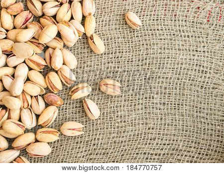 Heap Of Inshell Pistachios On Canvas Background