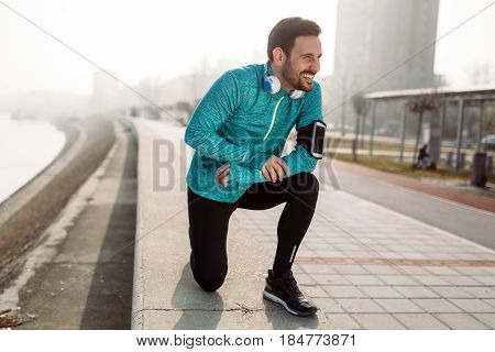 Active sportsman fitness exercising while running and jogging outdoor