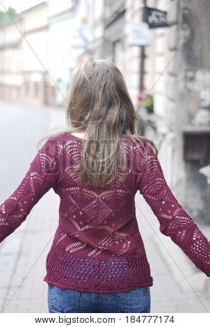 woman on the street with red sweater