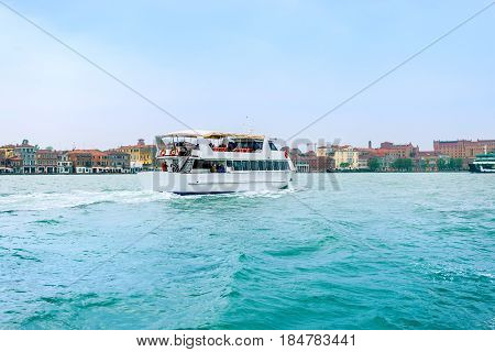 Venice Italy - April 27 2017: Tourist boat on Grand Canal which is heading to Venice Italy.