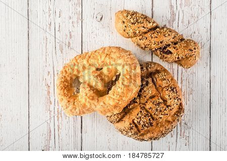 Fresh Seedy Breads On White Wooden Background