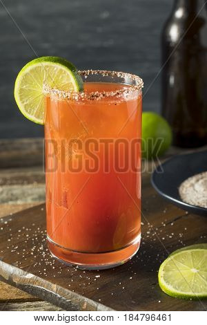 Homemade Michelada With Beer And Tomato Juice