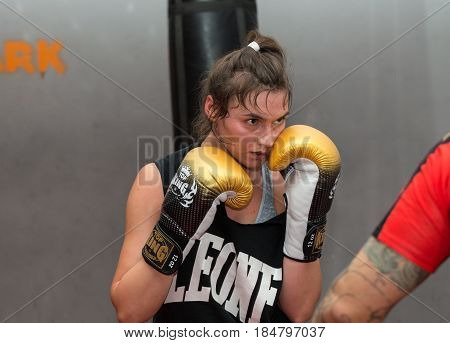 CRACOW POLAND - FEBRUARY 12 2016: Agnieszka Niestoj - talented Polish boxer durning boxing training with coach in the gym. Cracow Poland
