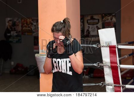 CRACOW POLAND - FEBRUARY 12 2016: Agnieszka Niestoj - talented Polish boxer durning boxing training with coach in the gym. Cracow Poland