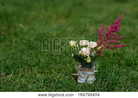 Beautiful Wedding Ceremony Outdoors. Decorated Chairs Stand On The Grass. Wedding Arch Made  Flowers