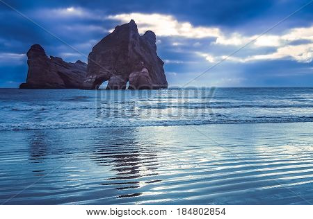 Archway Islands on the beach at Wharariki Beach near Nelson New Zealand