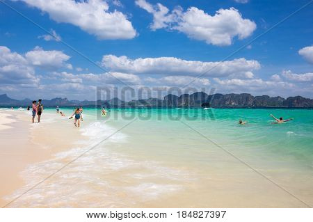 CRABI PROVINCE THAILAND - FEBRUARY 02 2015: Tourists swimming in turquoise water of Andaman sea at Krabi province Thailand