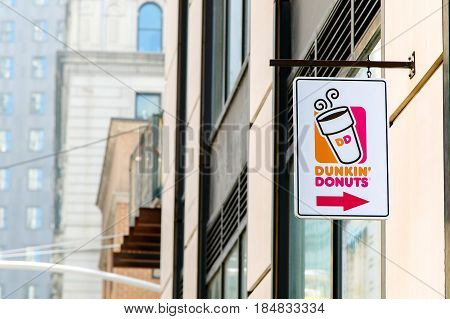New York April 28 2017: A sign over an entrance to a Dunkin Donuts location in Manhattan.