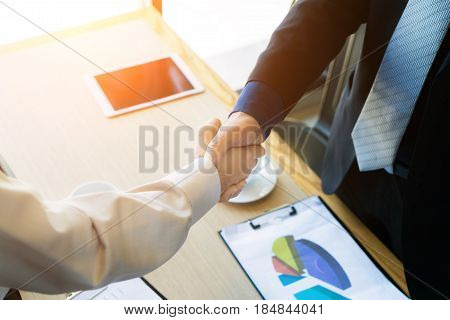 Business colleagues handshake. Businesspeople shaking hands after a successful meeting. Business concept.