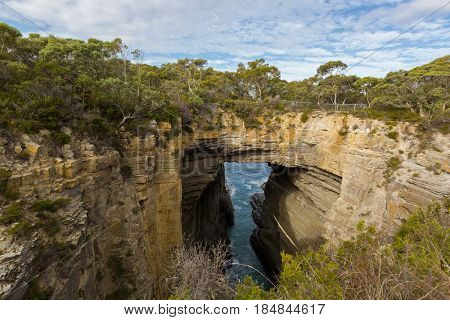 Tasmans Arch, former sea cave, unusual geological formations at Tasman National Park, south east coast of Tasmania, Australia.