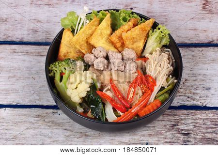 Crisy Wonton And Meat Ball In Chinese Kale Soup .